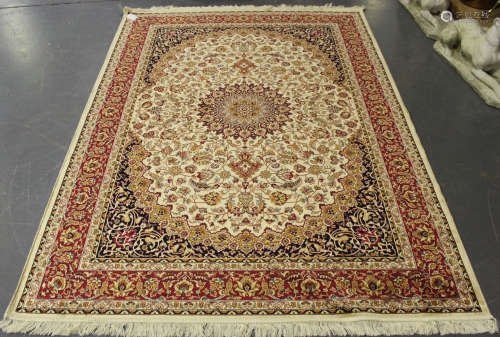 A modern machine made Kashan style rug