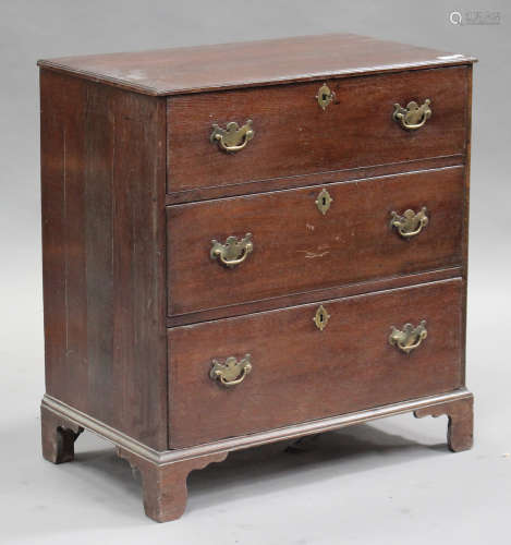 A George III oak chest of three drawers