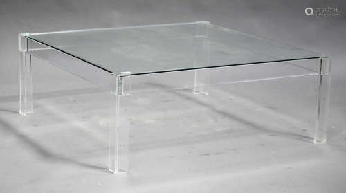 A contemporary glass and clear perspex square coffee table