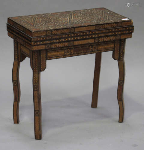 An early 20th century Damascus ware fold-over games table