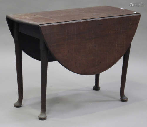 A George III mahogany oval drop-flap table