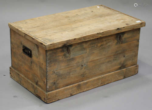 A 20th century stripped pine trunk with carrying handles