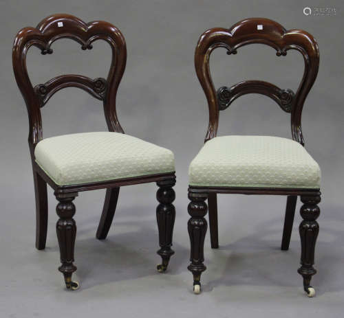 A set of six late Victorian mahogany spoon back dining chairs with overstuffed seats