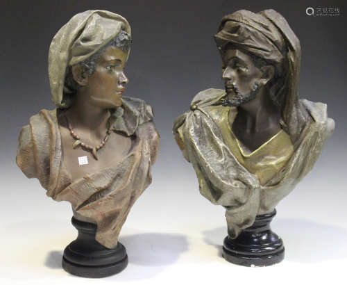 A near pair of 20th century Continental cast plaster head and shoulders portrait busts of a Moorish male and female