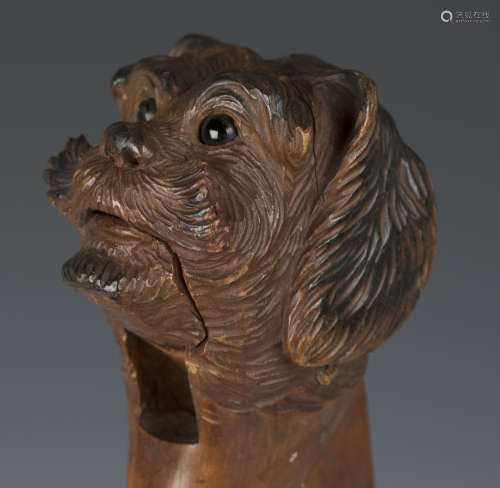 A late 19th century Swiss Black Forest carved softwood novelty nutcracker in the form of a dog's head