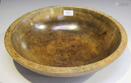 A 19th century turned sycamore dairy bowl with a good overall patina