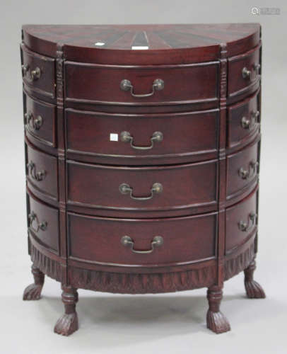 A late 20th century reproduction hardwood demi-lune chest