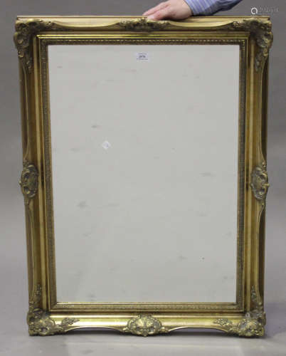 A late 20th century Victorian style gilt framed wall mirror with leaf scroll decoration