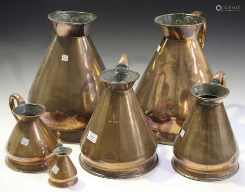 A group of six late 19th/early 20th century copper 'haystack' measuring jugs
