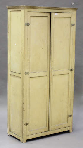 A mid-20th century cream painted pine two-door side cabinet