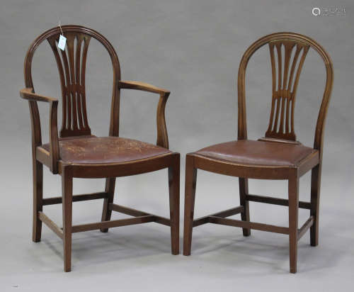A set of eight 20th century George III style mahogany arched splat back dining chairs with drop-in seats