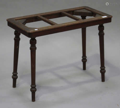 An Edwardian oak and mahogany luggage rack