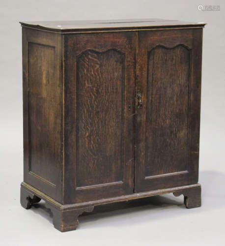 A George III provincial oak cupboard