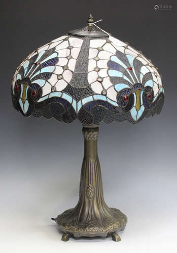 A large late 20th century Tiffany style table lamp with a stained and leaded glass shade