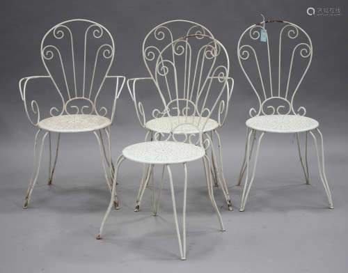A set of four French white painted wrought metal garden chairs
