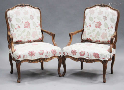A pair of 20th century French beech framed fauteuil armchairs