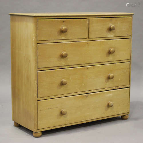 A late Victorian stripped pine chest of two short and three long drawers