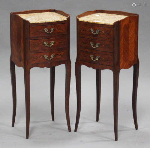 A pair of early 20th century French kingwood bedside cabinets with inset marble tops