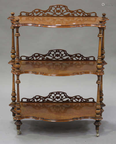 A mid-Victorian and later walnut three-tier whatnot