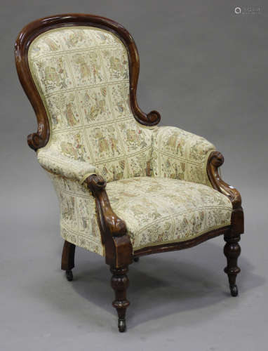 A late Victorian walnut showframe gentleman's armchair