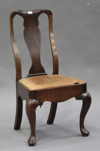 An early 18th century oak splat back chair with a drop-in seat