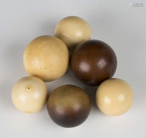 A group of five 19th century ivory bagatelle balls