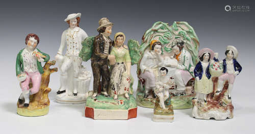 A collection of Staffordshire pottery figure groups