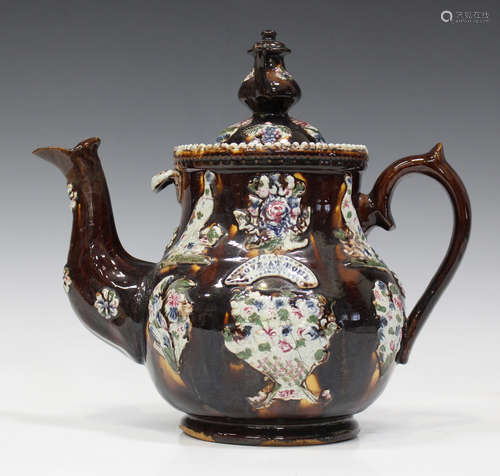 A Measham Bargeware teapot and cover