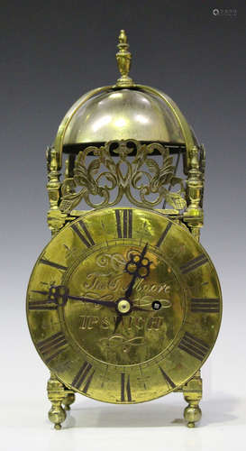 A late 17th century style brass lantern clock of typical design with single fusee movement striking on a bell