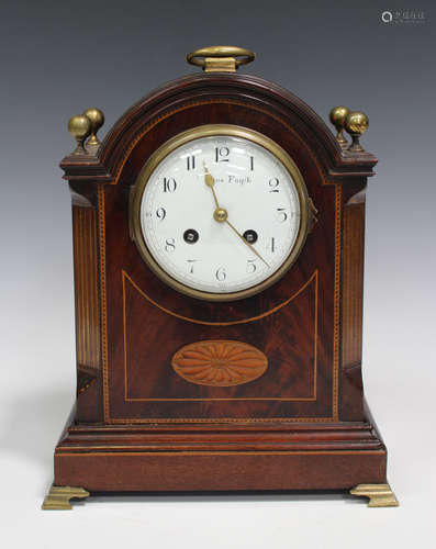 An Edwardian mahogany mantel clock with French eight day movement striking on a gong