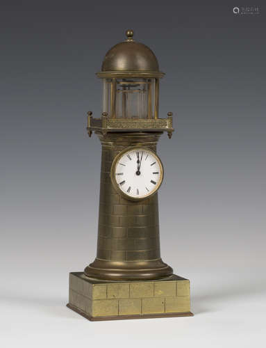 A late 19th century French brass novelty mantel timepiece in the form of a lighthouse