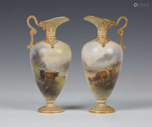 A pair of Royal Worcester porcelain pierced ewers