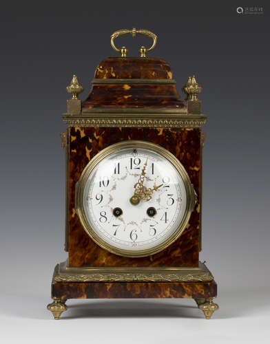 A late 19th century French brass mounted tortoiseshell mantel clock with eight day movement striking on a gong