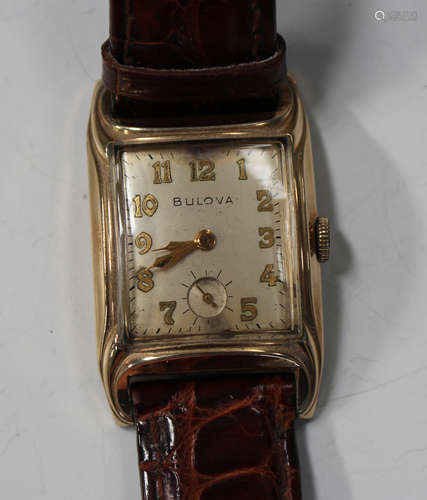 A Bulova gilt metal curved rectangular cased gentleman's wristwatch with signed movement