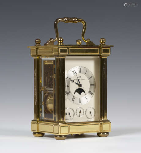 A late 20th century lacquered brass cased carriage alarm clock with eight day jewelled movement striking and repeating on a gong