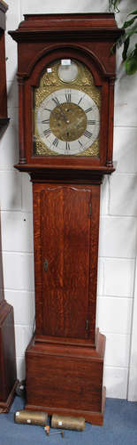 A George III oak longcase clock with eight day movement striking on a bell