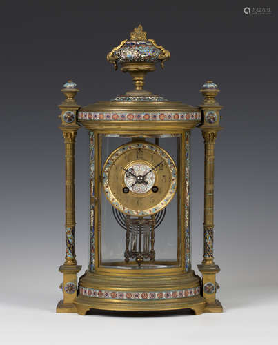 A late 19th century French brass and champlevé enamel four glass mantel clock with eight day movement striking on a gong