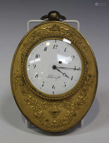 An early 19th century French ormolu oval cased sedan timepiece