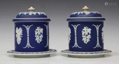 A pair of blue dip jasperware cylindrical jars