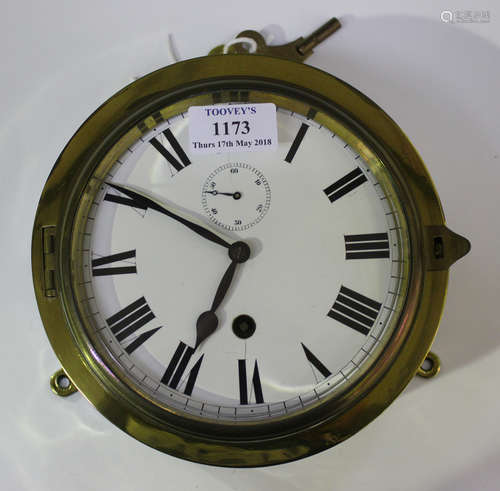 An early 20th century brass and steel cased circular ship's timepiece