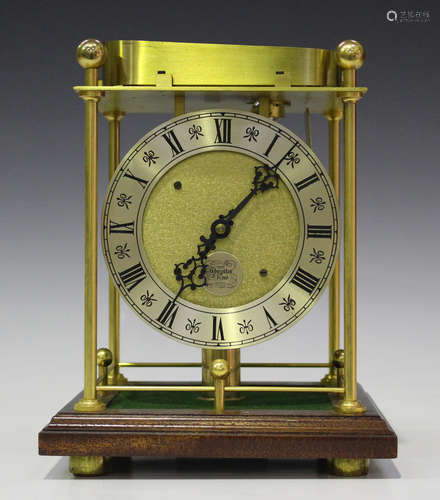 A late 20th century Thwaites & Reed spheroid rolling ball weight desk timepiece