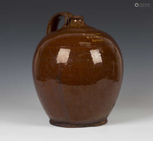 A Sussex pottery brown slip glazed flagon