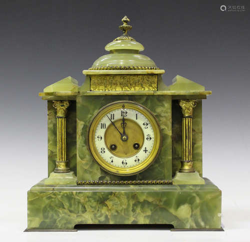 An early 20th century green onyx mantel clock with eight day movement striking on a gong via an outside countwheel