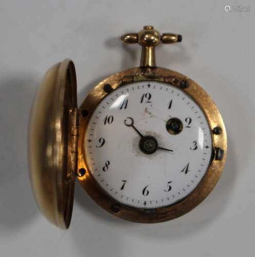 An early 19th century gold hunting cased keywind open-faced miniature pocket watch