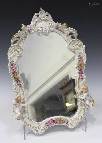 A Continental porcelain framed mirror