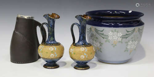 A pair of Royal Doulton stoneware ewers