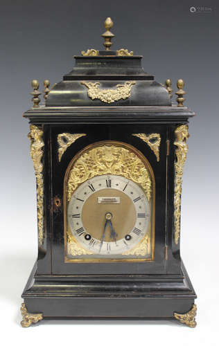 A late 19th century brass mounted ebonized bracket clock with eight day movement striking on two gongs