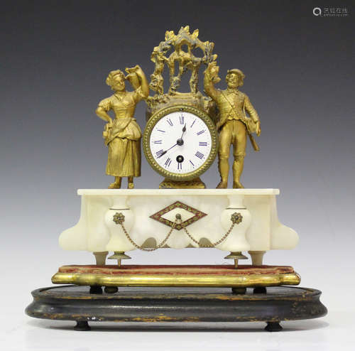 A late 19th century French gilt spelter and alabaster mantel timepiece with drum cased movement