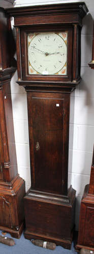 A George III oak longcase clock with thirty hour movement striking on a bell