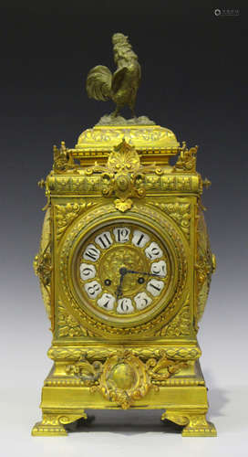 A late 19th century French brass mantel clock with eight day movement striking on a gong